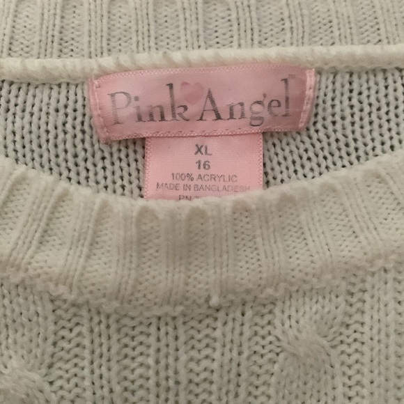 selling a pink angel sweater,colour is just white and the size is US (16) XL. - Picture 4 of 4